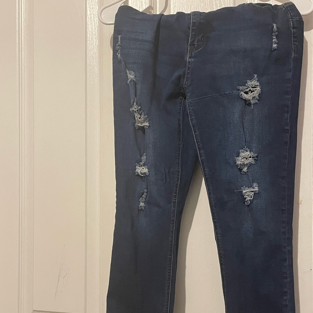 Ripped dark blue jeans